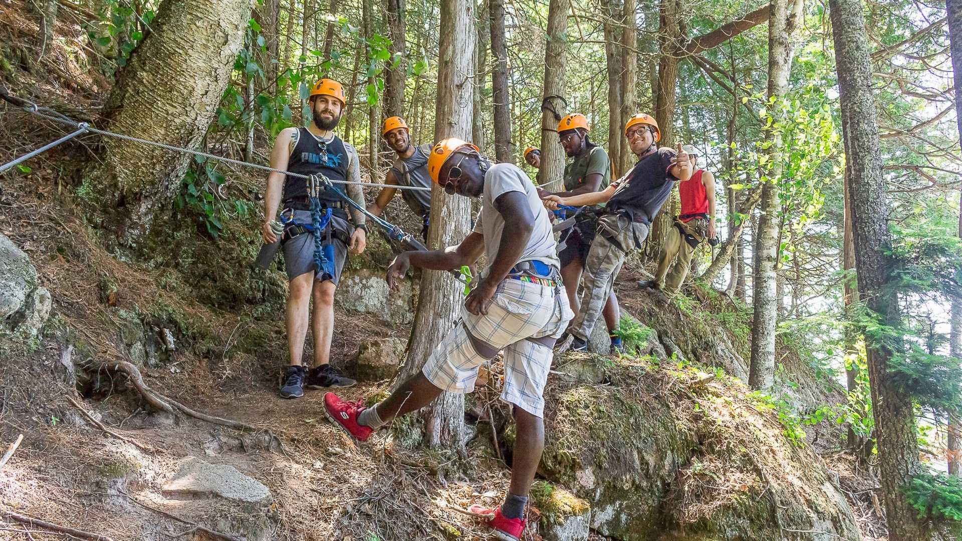 A group of men enjoying their forest exploration